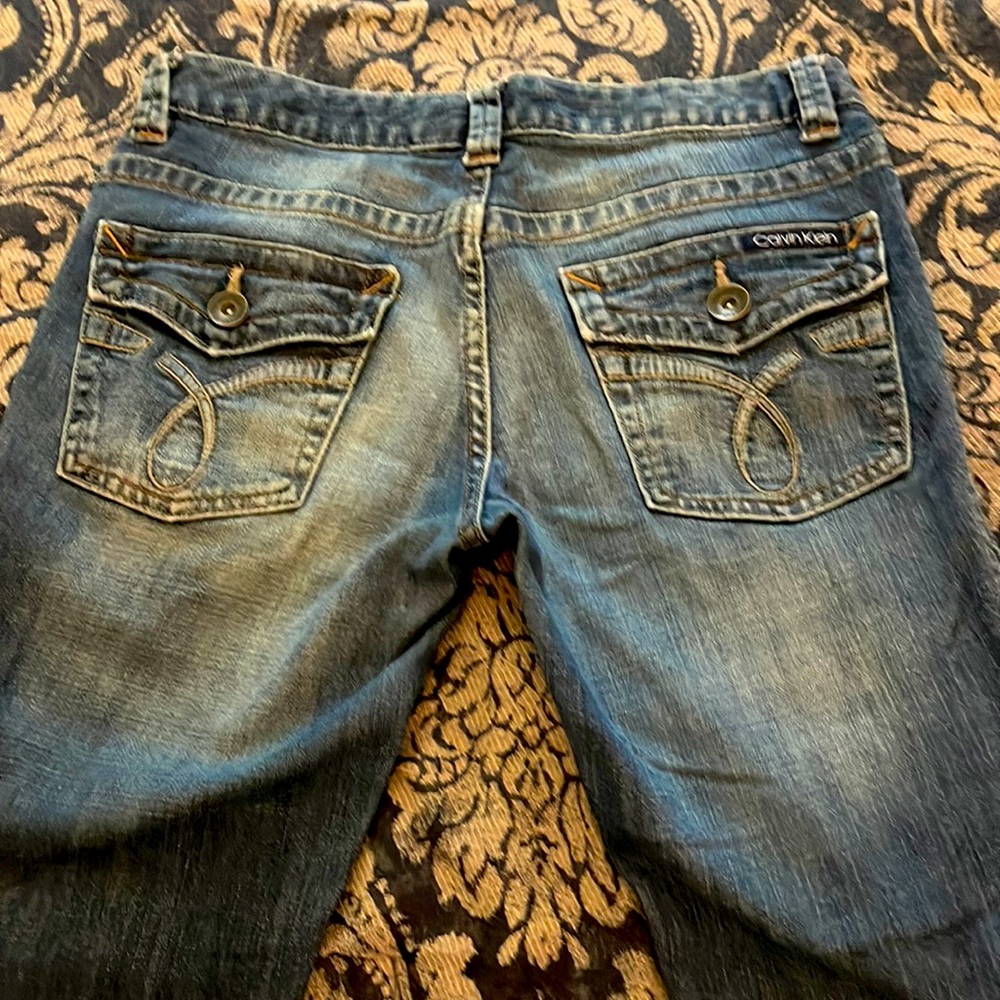 Calvin Klein distressed denim jeans, size 6,lean bootcut, excellent condition.